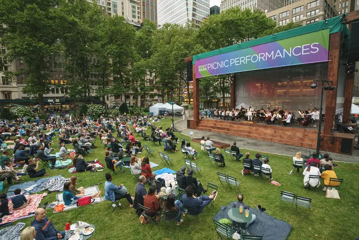 A photo of the NY Philharmonic performing at Bryant Park in 2021